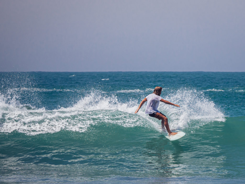 Surfer enjoying those perfect waves in Hiriketiya